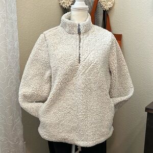 Heavy fleece pullover. Ladies design. Pockets and lined. Beige color. Size LG.